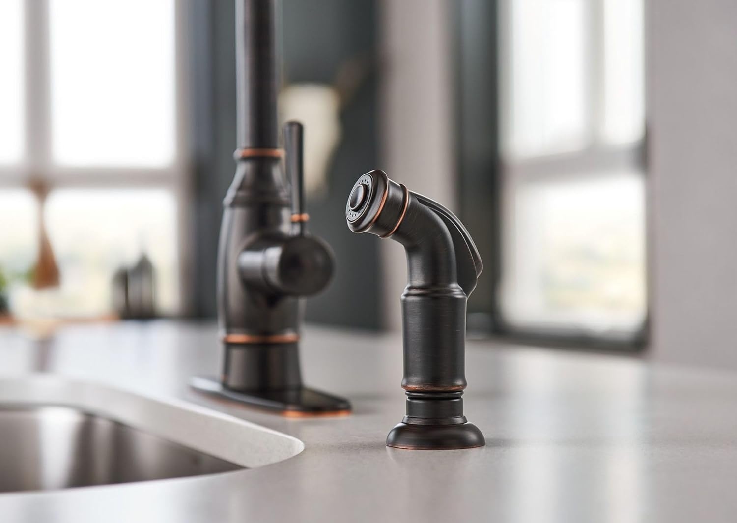 image:imageMoen Noell 1Handle Kitchen Faucet with Side Sprayer 87506BRB Singlehandle faucet Side sprayer included Deckmounted installation Mediterranean bronze finish Kitchen sink faucet