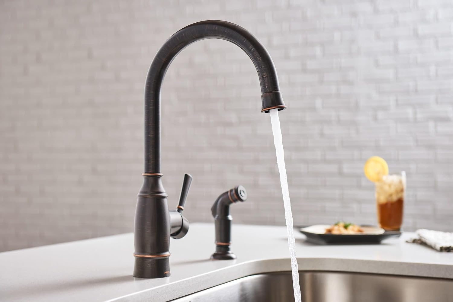 image:imageMoen Noell 1Handle Kitchen Faucet with Side Sprayer 87506BRB Singlehandle faucet Side sprayer included Deckmounted installation Mediterranean bronze finish Kitchen sink faucet