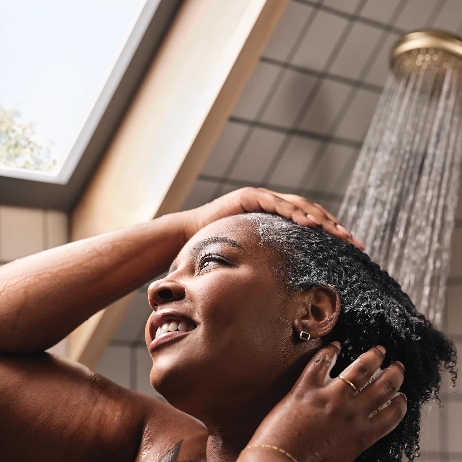 image:imageMoen 82775BL Beric SingleHandle Tub and Shower Faucet with Handshower and Metal Hose Valve Included IPS Tub Spout Matte BlackBronzed Gold